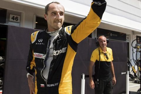 FILE - This is a Wednesday, August 2, 2017 file photo of former Formula One driver Robert Kubica of Poland participates in a test session for Team Renault on the Hungaroring circuit in Mogyorod, 23 kms north-east of Budapest, Hungary. Renault is undecided whether Robert Kubica will get a shot at driving in Formula One next year. The 32-year-old Polish driver, who last raced in F1 seven years ago, drove a Renault F1 car in testing at the Hungaroring circuit in Hungary last month. (Szilard Koszticsak/MTI File via AP)