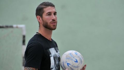UNICEF ambassador Sergio Ramos, of Spain's national soccer team and Real Madrid holds a soccer ball during an exhibition match in Havana, Cuba, Monday, June 16, 2015.  (ANSA/AP Photo/Ladyrene Perez, Cubadebate)