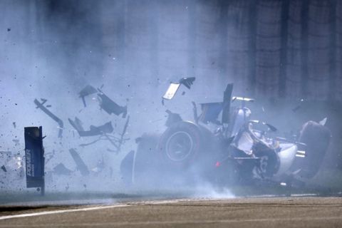 Sauber driver Antonio Giovinazzi of Italy crashes into the wall during the qualifying session for the Chinese Formula One Grand Prix at the Shanghai International Circuit in Shanghai, China, Saturday, April 8, 2017. (AP Photo/Mark Schiefelbein)