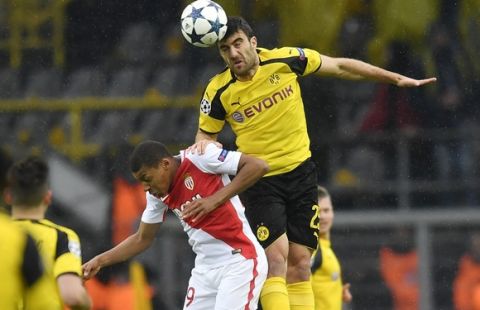 Monaco's Kylian Mbappe, left, and Dortmund's Sokratis Papastathopoulos go for a header during the Champions League quarterfinal first leg soccer match between Borussia Dortmund and AS Monaco in Dortmund, Germany, Wednesday, April 12, 2017. (AP Photo/Martin Meissner)