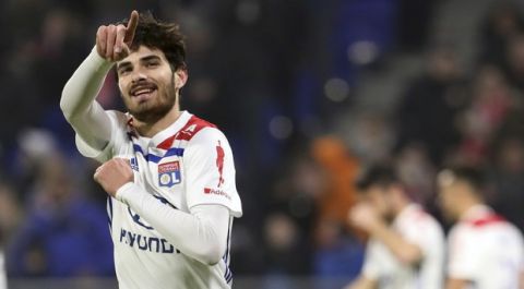Lyon's Martin Terrier celebrates after scoring his side's opening goal during the French League One soccer match between Lyon and Guingamp at the Stade de Lyon near Lyon, France, Friday, Feb. 15, 2019. (AP Photo/Laurent Cipriani)