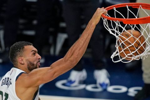 Utah Jazz center Rudy Gobert (27) dunks against the Dallas Mavericks in the second half of Game 4 of an NBA basketball first-round playoff series, Saturday, April 23, 2022, in Salt Lake City. (AP Photo/Rick Bowmer)