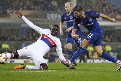 Lyon's Mouctar Diakhaby , left, defends against Everton's Kevin Mirallas during a Group E Europa League soccer match between Everton F.C. and Olympique Lyon at Goodison Park Stadium, Liverpool, England, Thursday Oct. 19, 2017. (AP Photo/Dave Thompson)