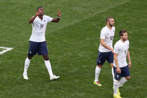 BRASILIA, BRAZIL - JUNE 30:  Paul Pogba of France (L) celebrates scoring his team's first goal during the 2014 FIFA World Cup Brazil Round of 16 match between France and Nigeria at Estadio Nacional on June 30, 2014 in Brasilia, Brazil.  (Photo by Celso Junior/Getty Images)
