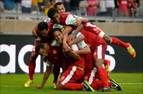 BELO HORIZONTE, BRAZIL - JUNE 17:  Jonathan Tehau of Tahiti celebrates with his team-mates after scoring his team's first goal during the FIFA Confederations Cup Brazil 2013 Group B match between Tahiti and Nigeria at Governador Magalhaes Pinto Estadio Mineirao on June 17, 2013 in Belo Horizonte, Brazil.  (Photo by Laurence Griffiths/Getty Images) ORG XMIT: 168637242