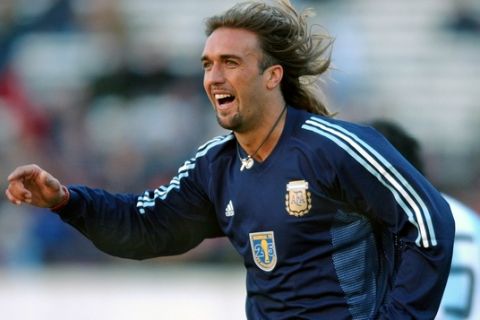** FILE ** Argentine striker Gabriel Batistuta celebrates a goal during a game in Buenos Aires, Argentina July 9, 2003 to commemorate the 25th anniversary of the World Cup won in 1978. Plagued by knee injuries, he released a statement Sunday March 13, 2005 saying he is retiring, a day after ending his contract prematurely with Al-Arabi, where he moved in 2003.  Batistuta, who retired from Argentina's national team three years ago, played on World Cup teams in 1994, '98, and 2002. He also led Argentina to Copa America titles in 1991 and '93. (AP Photo/Daniel Luna) ** EFE OUT **