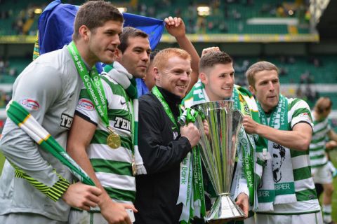 GLASGOW, SCOTLAND - MAY 13: Neil Lennon, coach of Celtic, holds the Clydesdale Bank Premier League trophy following the Clydesdale Bank Premier League match between Celtic and Hearts, at Celtic Park on May 13, 2012 in Glasgow, Scotland. (Photo by Jeff J Mitchell/Getty Images)