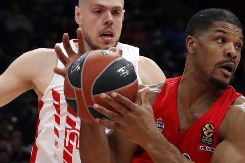 CSKA Moscow's Kyle Hines, right, drives to the basket as Red Star's Vladimir Stimac blocks him during their Euroleague basketball match in Belgrade, Serbia, Friday, Feb. 21, 2020. (AP Photo/Darko Vojinovic)