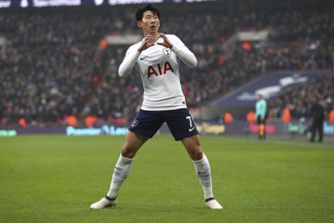 Tottenham Hotspur's Son Heung-Min celebrates scoring his side's first goal of the game against Huddersfield during their English Premier League soccer match at Wembley Stadium in London, Saturday March 3, 2018. (John Walton/PA via AP)