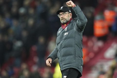Liverpool manager Jürgen Klopp waves to the crowd following his team's 3-2 win in the English Premier League soccer match between Liverpool and West Ham at Anfield Stadium in Liverpool, England, Monday, Feb. 24, 2020. (AP Photo/Jon Super)