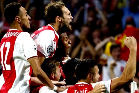 Ajax players celebrate scoring their first goal during a Group E Champions League soccer match between Ajax and AEK at the Johan Cruyff ArenA in Amsterdam, Netherlands, Wednesday, Sept. 19, 2018. (AP Photo/Peter Dejong)