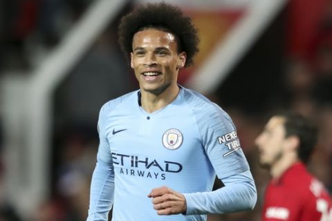 Manchester City's Leroy Sane celebrates after scoring his side's second goal during the English Premier League soccer match between Manchester United and Manchester City at Old Trafford Stadium in Manchester, England, Wednesday April 24, 2019. (AP Photo/Jon Super)