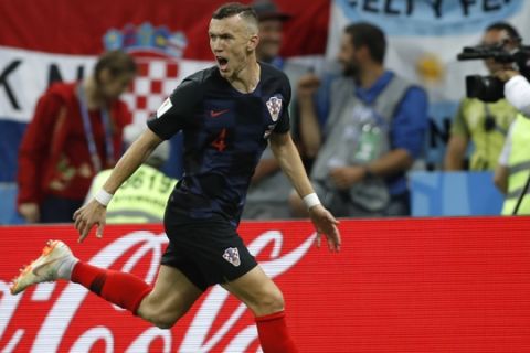 Croatia's Ivan Perisic celebrates after scoring his side's first goal during the semifinal match between Croatia and England at the 2018 soccer World Cup in the Luzhniki Stadium in Moscow, Russia, Wednesday, July 11, 2018. (AP Photo/Francisco Seco)
