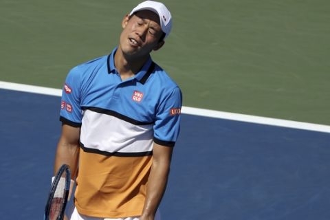 Kei Nishikori, of Japan, reacts after losing a point to Alex de Minaur, of Australia, during round three of the US Open tennis championships Friday, Aug. 30, 2019, in New York. (AP Photo/Kevin Hagen)