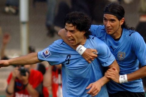 Uruguay's Luis Suarez, left, and Sebastian Abreu celebrate a goal against Chile during a World Cup 2010 qualifying soccer match in Montevideo, Sunday, Nov. 18, 2007.(AP Photo/Matilde Campodonico)