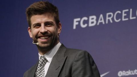 FC Barcelona's Gerard Pique smiles during the official announcement of his contract renewal at the Camp Nou stadium in Barcelona, Spain, Monday, Jan. 29, 2018. Barcelona says it has reached a deal to renew Gerard Pique's contract until 2022, adding a buyout clause of 500 million euros ($611 million). (AP Photo/Manu Fernandez)
