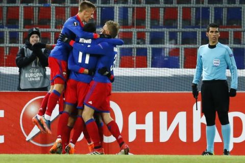 CSKA players celebrate after scoring their side's first goal during the Europa League soccer match between CSKA Moscow and Red Star, in Moscow, Russia, Wednesday, Feb. 21, 2018. (AP Photo/Alexander Zemlianichenko)