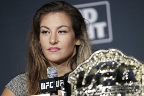 FILE--In this July 6, 2016, file photo, Miesha Tate speaks during a UFC 200 mixed martial arts news conference in Las Vegas. Tate says she's inspired by the tough little girl who broke her arm while hiking near Las Vegas; the mixed martial arts fighter carried the child back down the mountain. Tate posted on Facebook that she encountered the 6-year-old Sunday, Sept. 4, 2016, on the popular Mary Jane Falls trail of Mount Charleston, about 40 miles northwest of Las Vegas. (AP Photo/John Locher, file)