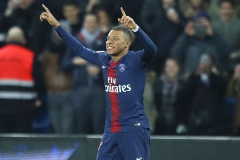 PSG's Kylian Mbappe celebrates after scoring his side's fifth goal during the French League One soccer match between Paris Saint Germain and Montpellier at the Parc des Princes stadium in Paris, France, Wednesday, Feb. 20, 2019. (AP Photo/Francois Mori)