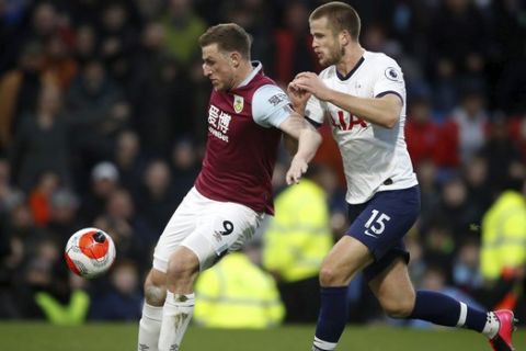 Burnley's Chris Wood, left, and Tottenham Hotspur's Eric Dier battle for the ball during the English Premier League soccer match at Turf Moor, Burnley, England, Saturday March 7, 2020. (Martin Rickett/PA via AP)