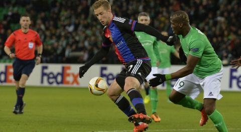Basel's Austrian forward Marc Janko  (L) vies for the ball with Saint-Etienne's Guinean defender Florentin Pogba (R) during the UEFA Europa league round of sixteen football match Saint-Etienne (ASSE) vs Basel (FCB) on February 18, 2016, at the Geoffroy Guichard Stadium in Saint-Etienne, central France. AFP PHOTO / JEAN-PHILIPPE KSIAZEK / AFP / JEAN-PHILIPPE KSIAZEK        (Photo credit should read JEAN-PHILIPPE KSIAZEK/AFP/Getty Images)
