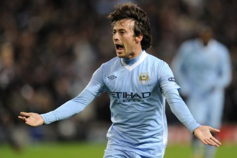 Manchester City's Spanish midfielder David Silva celebrates after scoring the opening goal during the UEFA Champions league, Group A, football match between Manchester City and Bayern Munich at the Etihad stadium in Manchester, north-west England, on December 7, 2011.  AFP PHOTO/ODD ANDERSON (Photo credit should read ODD ANDERSEN/AFP/Getty Images)