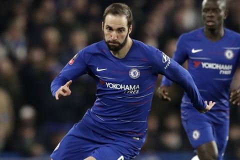Chelsea's Gonzalo Higuain runs with the ball during the English FA Cup fifth round soccer match between Chelsea and Manchester United at Stamford Bridge stadium in London, Monday, Feb. 18, 2019. (AP Photo/Matt Dunham)