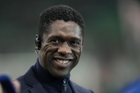 Former Dutch soccer player Clarence Seedorf smiles as he speaks to media ahead of the Champions League group B soccer match between AC Milan and Porto at the San Siro stadium in Milan, Italy, Wednesday, Nov. 3, 2021. (AP Photo/Luca Bruno)