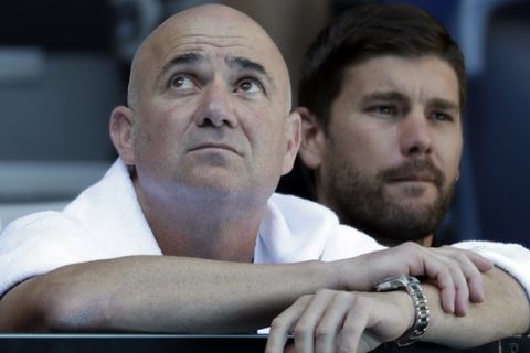 Andre Agassi, coach of Bulgaria's Grigor Dimitrov watches his fourth round match against United States' Frances Tiafoe at the Australian Open tennis championships in Melbourne, Australia, Sunday, Jan. 20, 2019. (AP Photo/Kin Cheung)