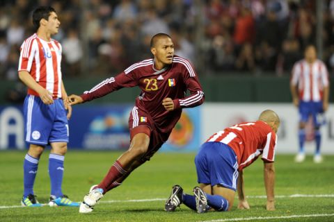 Venezuelan forward Jose Rondon (C) celebrates after scoring against Paraguay near Paraguayan midfielder Cristian Riveros and defender Dario Veron during a 2011 Copa America Group B first round football match held at the Padre Ernesto Martearena stadium in Salta, 1617 Km northwest of Buenos Aires, on July 13, 2011. AFP PHOTO / EVARISTO SA (Photo credit should read EVARISTO SA/AFP/Getty Images)