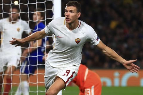 Roma's Edin Dzeko celebrates scoring his side's second goal of the game during the Champions League group C soccer match between Chelsea and Roma at Stamford Bridge stadium in London, Wednesday, Oct. 18, 2017. (Tim Goode/PA via AP)