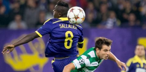 NK Maribor's Sintayehu Sallaich (L) vies for the ball with Cedric of Sporting Lisbon during UEFA Group G Champions League footbal match NK Maribor vs Sporting Lisbon in Maribor, Slovenia on September 17, 2014. AFP PHOTO / Jure Makovec        (Photo credit should read Jure Makovec/AFP/Getty Images)