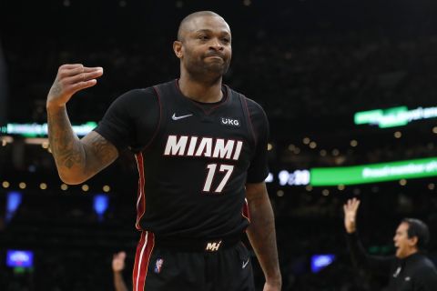 Miami Heat's P.J. Tucker reacts after making a 3-pointer against the Boston Celtics during the first half of Game 3 of the NBA basketball playoffs Eastern Conference finals Saturday, May 21, 2022, in Boston. (AP Photo/Michael Dwyer)