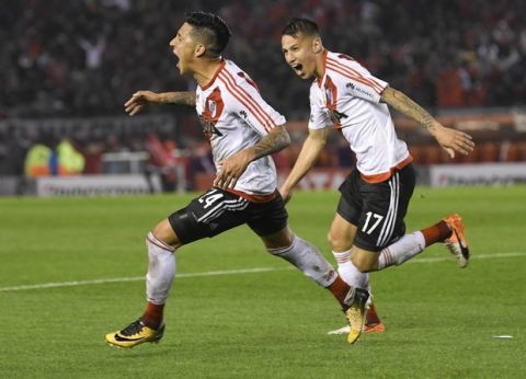 Ignacio Scocco, left, of Argentina's River Plate celebrates after scoring against Bolivia's Wilstermann, with teammate Carlos Auzqui during a Copa Libertadores soccer match in Buenos Aires, Argentina, Thursday, September 21, 2017. (AP Photo/Gustavo Garello)