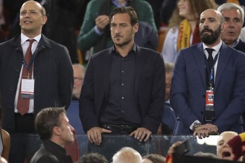 Former Roma player Francesco Totti, center, looks down from the stands during the Champions League semifinal second leg soccer match between Roma and Liverpool at the Olympic Stadium in Rome, Wednesday, May 2, 2018. (AP Photo/Alessandra Tarantino)
