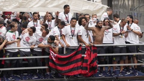 Players of Brazil's Flamengo parade at their arrival in Rio de Janeiro, Brazil, Sunday, Nov. 24, 2019. Flamengo overcame Argentina's River Plate 2-1 in the Copa Libertadores final match on Saturday in Lima to win its second South American title. (AP Photo/Ricardo Borges)