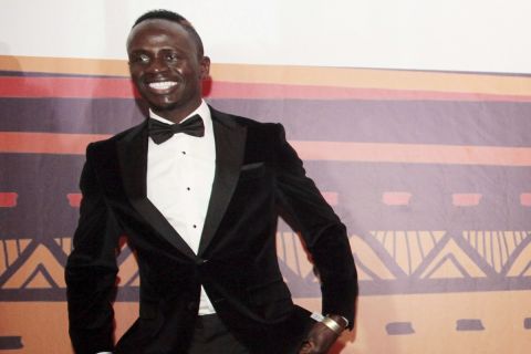 Mohamed Salah, right, and Sadio Mane of Senegal arrive at the Confederation of African Football awards ceremony in Accra, Ghana, Thursday Jan. 4, 2018. Salah won the African Player of the Year award on Thursday, for success on all fronts in 2017 for the Egypt forward after he inspired his country to a long-awaited World Cup place and had a phenomenal start to his career at Liverpool. (AP Photo/Christian Thompson)