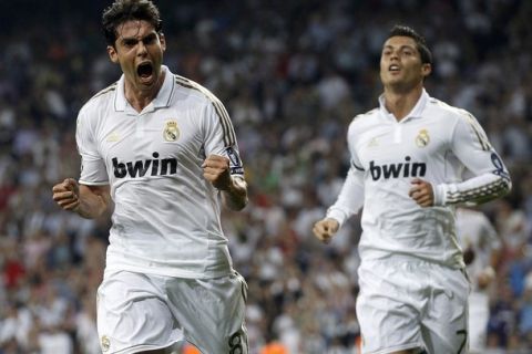 Real Madrid's Kaka screams in celebration after scoring a goal against Ajax Amsterdam as teammate Cristiano Ronaldo runs to join him during their Champions League Group D soccer match at Santiago Bernabeu stadium in Madrid September 27, 2011.      REUTERS/Juan Medina (SPAIN - Tags: SPORT SOCCER)