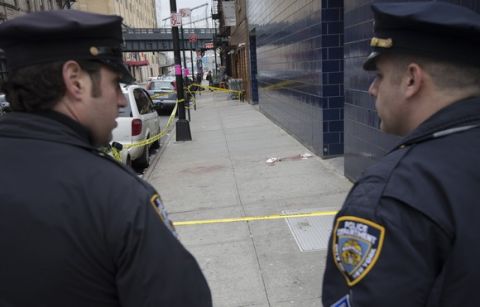 Police officers stand guard near 1 Oak nightclub on West 20th Street in New York where authorities say Indiana Pacers forward Chris Copeland, his wife and another woman were stabbed outside after an argument, early Wednesday, April 8, 2015. Police say the victims were hospitalized with minor injuries. (AP Photo/John Minchillo)