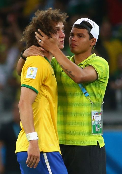 BELO HORIZONTE, BRAZIL - JULY 08:  Thiago Silva of Brazil (R) consoles teammate David Luiz after Germany's 7-1 victory during the 2014 FIFA World Cup Brazil Semi Final match between Brazil and Germany at Estadio Mineirao on July 8, 2014 in Belo Horizonte, Brazil.  (Photo by Robert Cianflone/Getty Images)