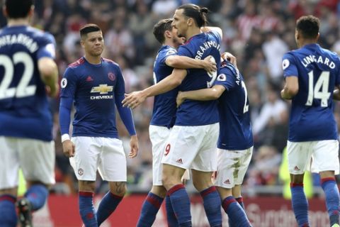 Manchester United's Zlatan Ibrahimovic, centre right, celebrates scoring his side's first goal of the game against Sunderland, during their English Premier League soccer match at the Stadium of Light in Sunderland, England, Sunday April 9, 2017. (Owen Humphreys/PA via AP)