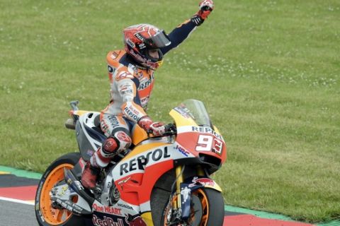 Moto GP rider Marc Marquez of Spain celebrates after winning the German Motorcycle Grand Prix at the Sachsenring circuit in Hohenstein-Ernstthal, Germany, Sunday, July 2, 2017. (AP Photo/Jens Meyer)