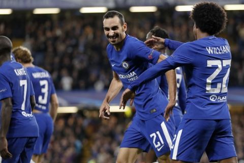Chelsea's Davide Zappacosta, second from right, celebrates with his teammate Willian, right, after scoring during the Champions League group C soccer match between Chelsea and Qarabag at Stamford Bridge stadium in London, Tuesday, Sept. 12, 2017. (AP Photo/Kirsty Wigglesworth)
