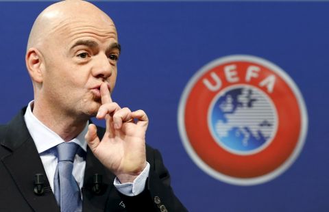 UEFA General Secretary Gianni Infantino asks the audience for silence before the draw for the play-off matches for UEFA Euro 2016 at the UEFA headquarters in Nyon, Switzerland, October 18, 2015. The draw will define the four pairings as well as the order of the home-and-away ties. The first legs will be played between 12 and 14 November and the return legs between 15 and 17 November in line with the Week of Football match pattern. REUTERS/Denis Balibouse      TPX IMAGES OF THE DAY     