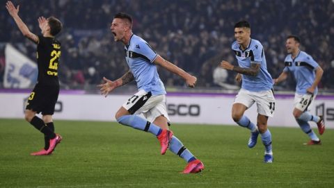Lazios Sergej Milinkovic-Savic, center, celebrates after he scored his side's second goal during the Serie A soccer match between Lazio and inter Milan, at Rome's Olympic stadium, Sunday, Feb. 16, 2020. (Alfredo Falcone/LaPresse via AP)
