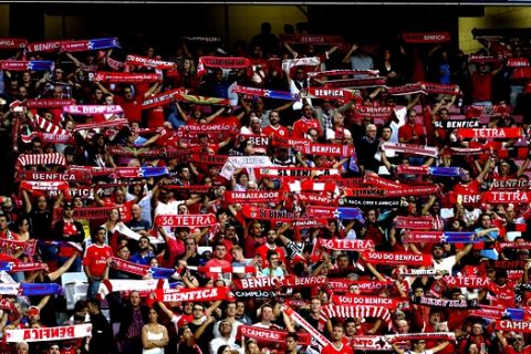 Fans of Benfica hold up their scarfs during the Champions League group A soccer match between SL Benfica and CSKA Moscow at the Luz stadium in Lisbon, Tuesday, Sept. 12, 2017. (AP Photo/Armando Franca)