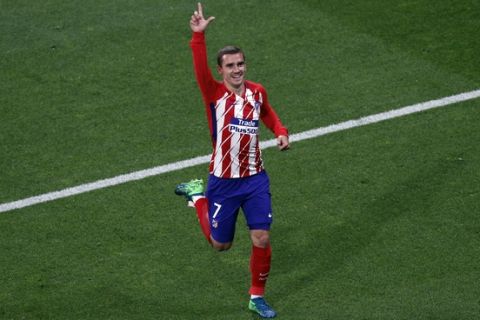 Atletico's Antoine Griezmann's celebrates his side opening goal during the Europa League Final soccer match between Marseille and Atletico Madrid at the Stade de Lyon outside Lyon, France, Wednesday, May 16, 2018. (AP Photo/Christophe Ena)