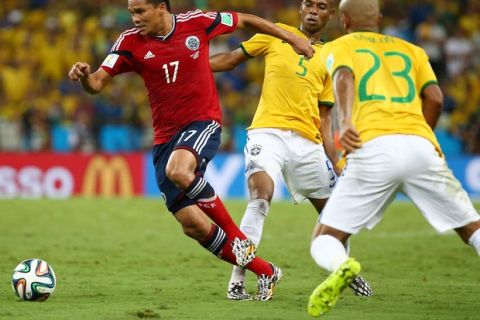 FORTALEZA, BRAZIL - JULY 04:  Carlos Bacca of Colombia is challenged by Fernandinho during the 2014 FIFA World Cup Brazil Quarter Final match between Brazil and Colombia at Castelao on July 4, 2014 in Fortaleza, Brazil.  (Photo by Robert Cianflone/Getty Images)