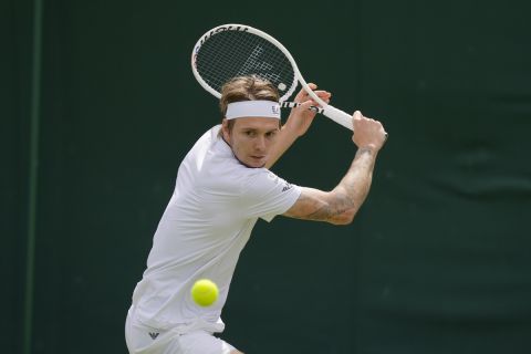 Kazakhstan's Alexander Bublik plays a return to J.J. Wolf of the US during the singles match on day four of the Wimbledon tennis championships in London, Thursday, July 6, 2023. (AP Photo/Alastair Grant)