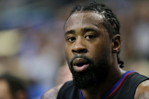 Los Angeles Clippers center DeAndre Jordan sits on the bench in the first half of an NBA basketball game against the Dallas Mavericks in Dallas, Thursday, March 23, 2017. (AP Photo/Tony Gutierrez)